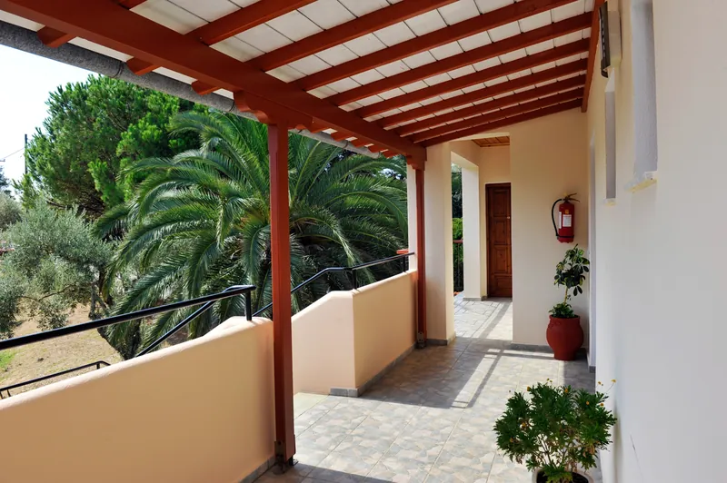 A porch looking out to the palms